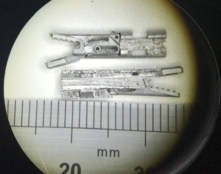 View through a microscope of a very small prototype set of jaws for attaching to the heart strings